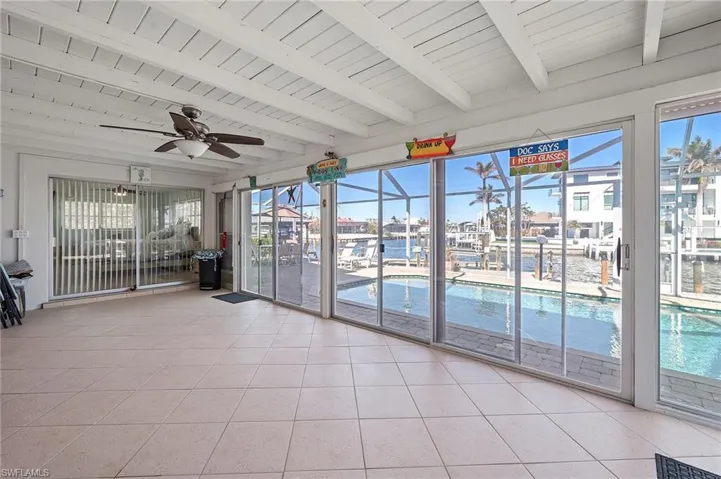Sunroom with tile floor and glass enclosure