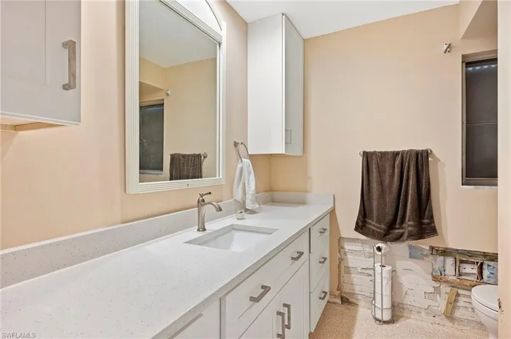 Bathroom featuring vanity and toilet