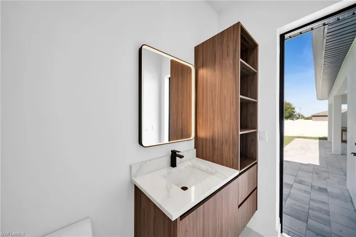 Bathroom with vanity and tile patterned flooring