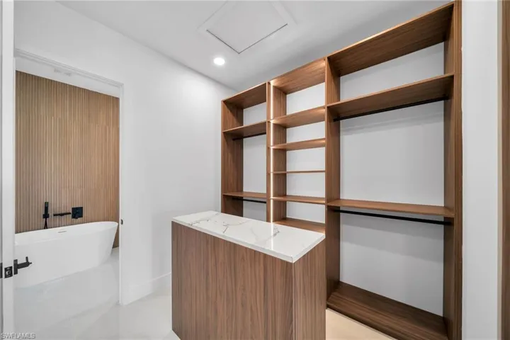 Walk in closet featuring light tile patterned floors