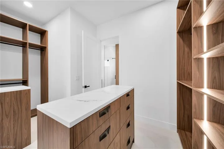 Walk in closet featuring light tile patterned flooring