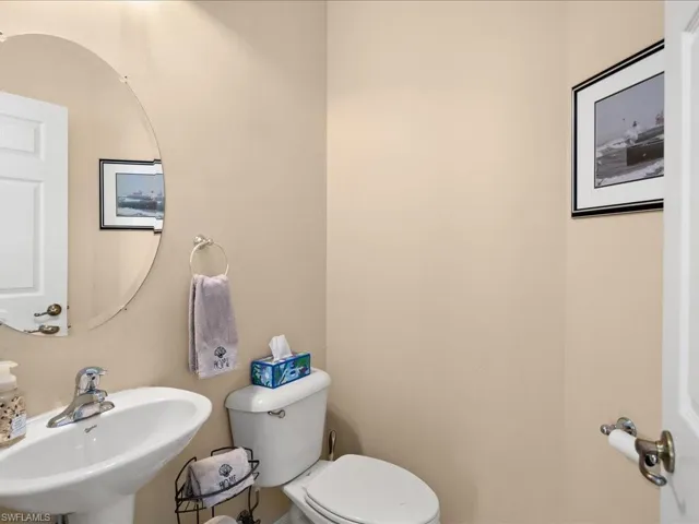 Bathroom featuring sink and toilet