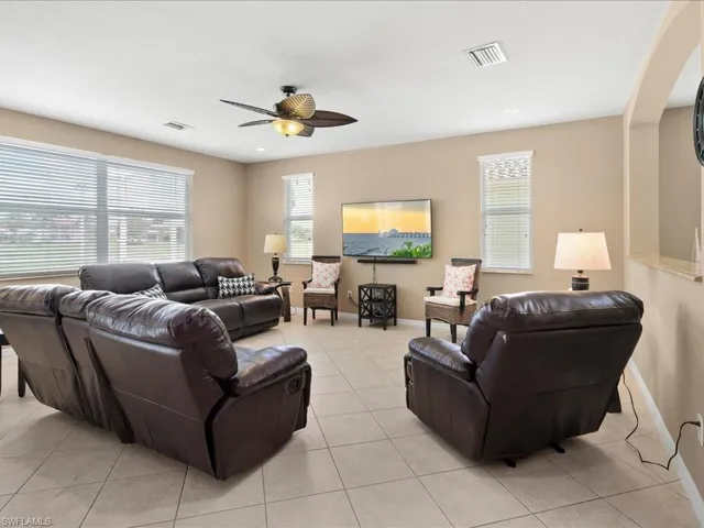 Tiled living room with ceiling fan
