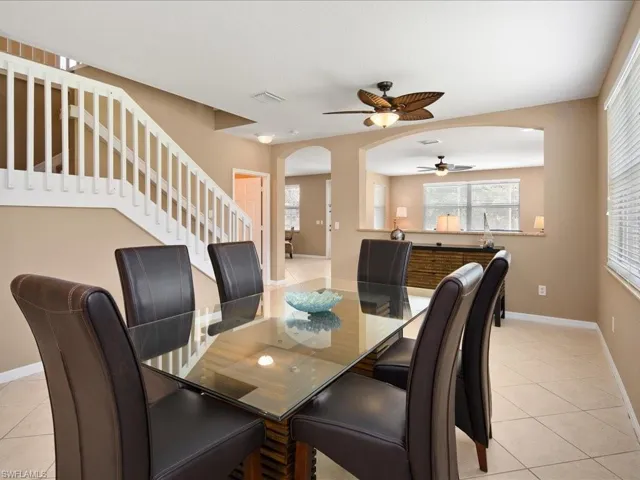 Tiled dining area with ceiling fan