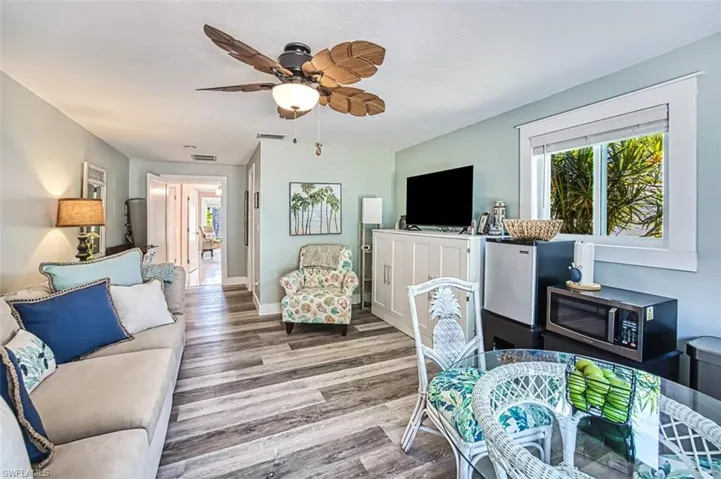 Living room featuring hardwood / wood-style floors and ceiling fan