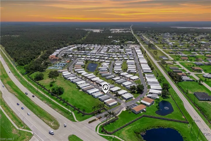 The aerial view presents a serene, secure neighborhood with ample greenery, recreational spots, and a friendly, close-knit community feel.