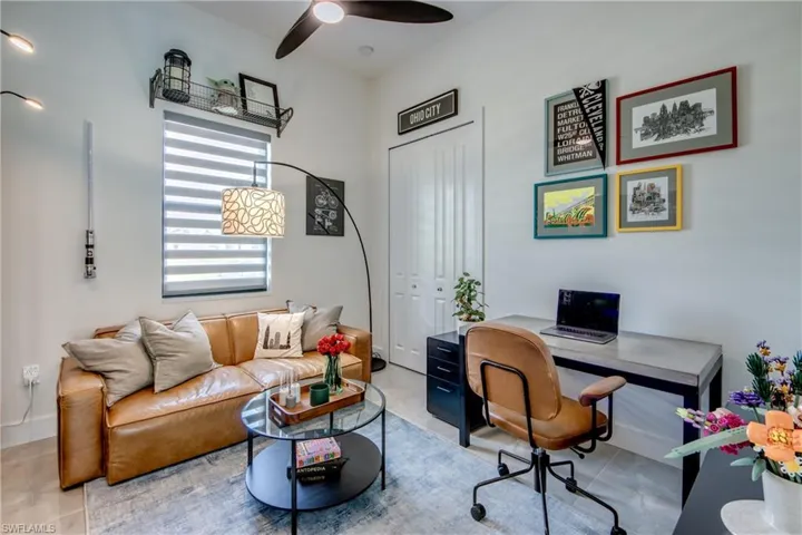 Home office with tile flooring and ceiling fan