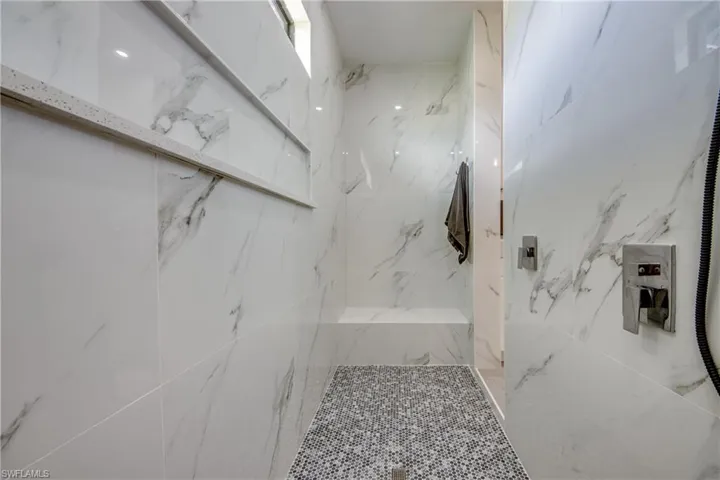 Bathroom with a tile shower