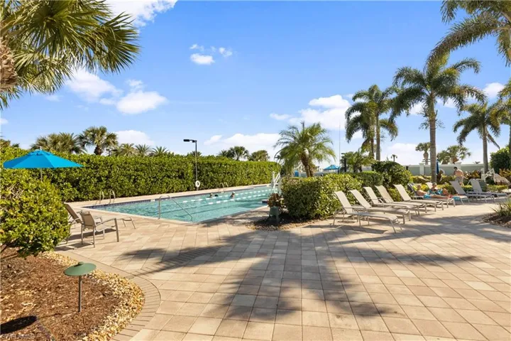 View of lap pool with a patio area