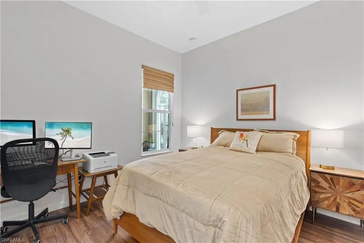 Bedroom with wood-type flooring and ceiling fan