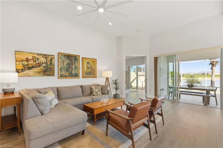 Living room with sliders to the lania with a wide water view