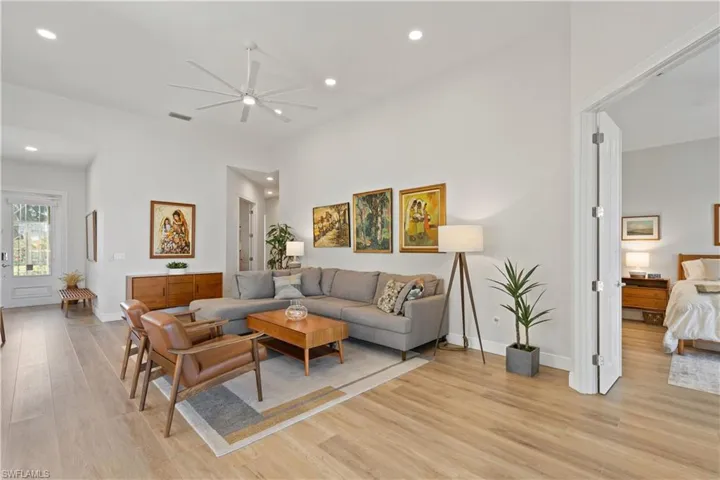 Living room featuring ceiling fan and recessed lighting