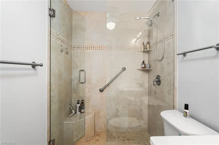 Bathroom with toilet and walk in shower