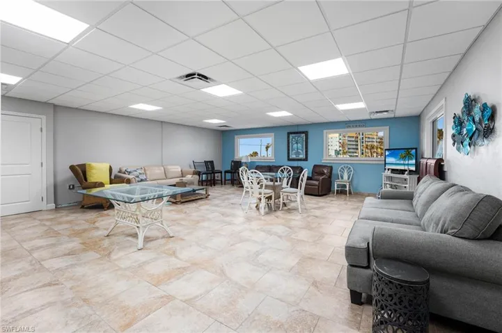Living room featuring a drop ceiling