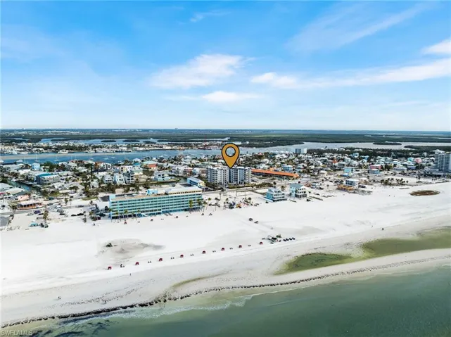 Bird's eye view with a water view and a view of the beach