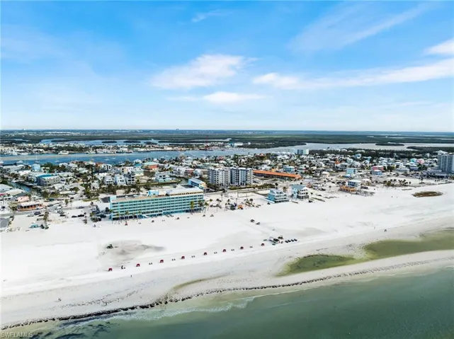 Bird's eye view featuring a water view and a view of the beach