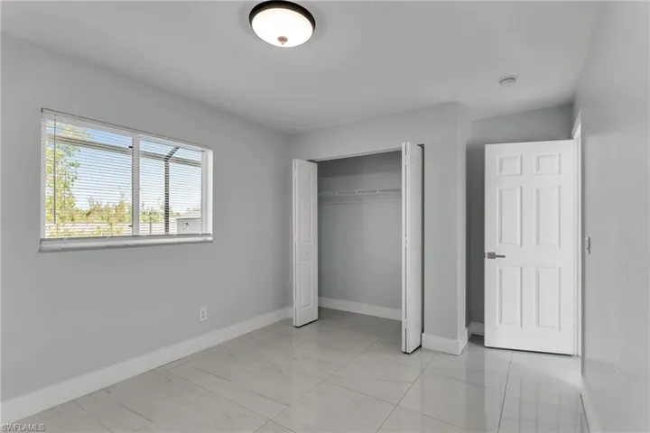 Unfurnished bedroom featuring a closet