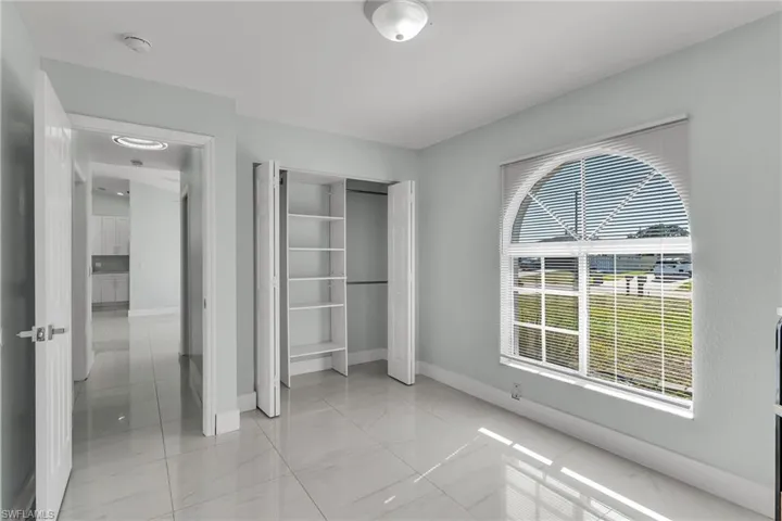 Unfurnished bedroom with a closet