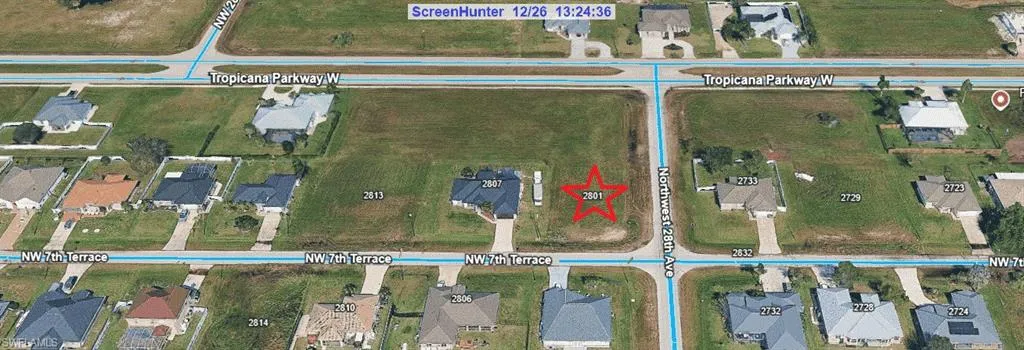 Aerial map of property and surrounding area featuring property with a red star.