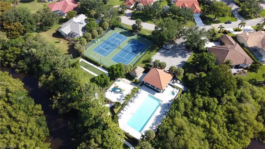 Aerial view of residential area featuring a pool