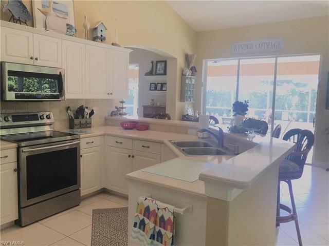 Kitchen looking out to pool & lanai