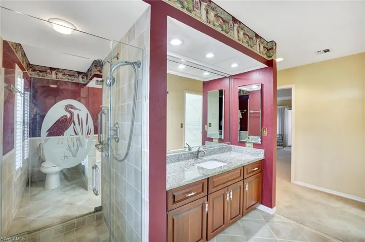 His & her bathroom with shared shower