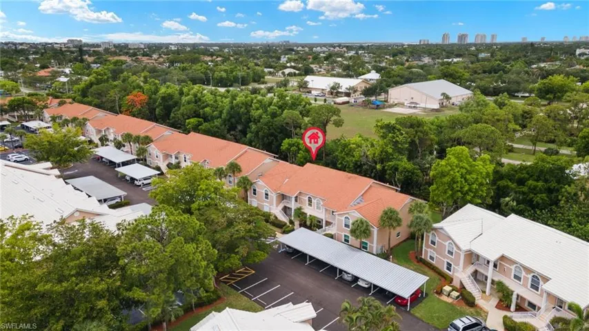 Aerial view of residential area with a tree filled landscape