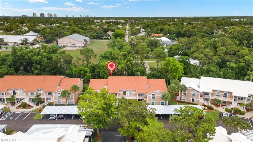 Aerial perspective of suburban area with a tree filled landscape