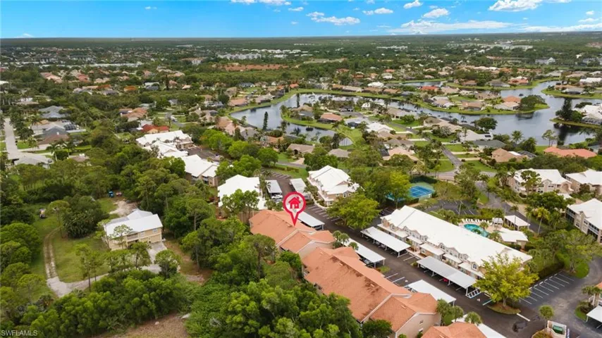 Aerial view of property's location featuring nearby suburban area