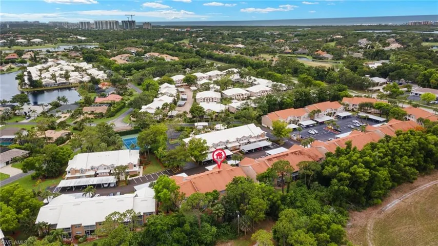 Aerial view of residential area with a large body of water