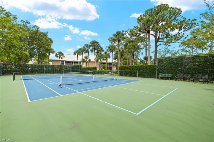 View of tennis court featuring community basketball court