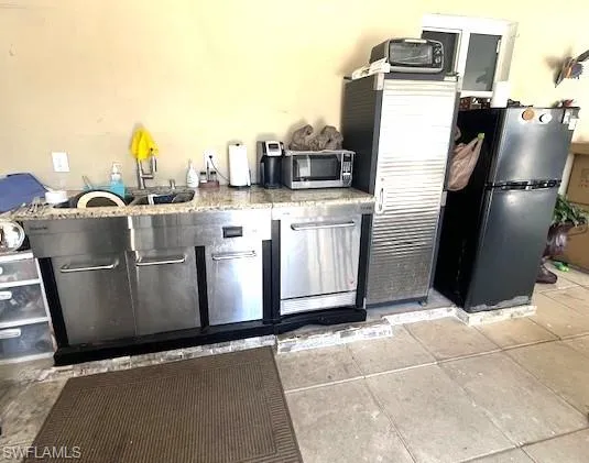 Kitchen featuring stainless steel appliances and a sink