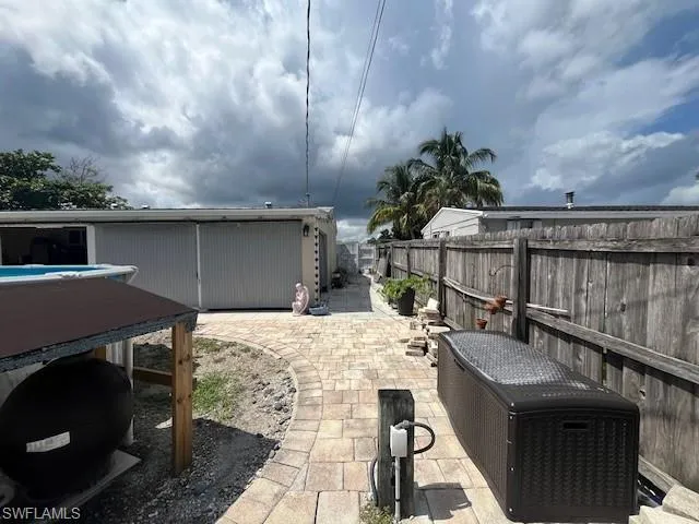 Fenced backyard featuring a patio