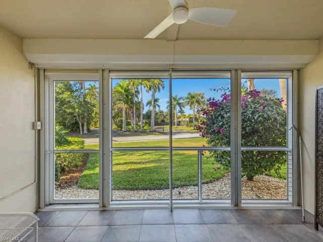 Unfurnished sunroom featuring ceiling fan and healthy amount of natural light