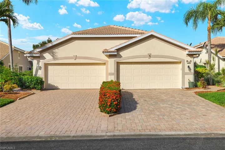 Mediterranean / spanish-style home featuring a garage
