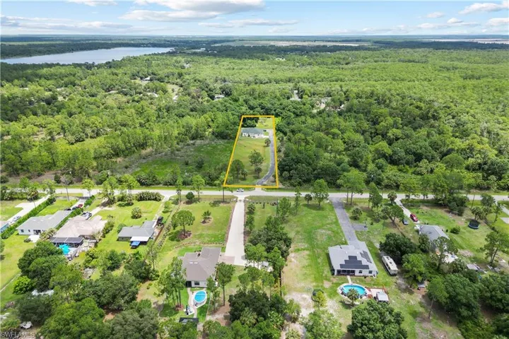 Expansive acreage with a single-story residence and private driveway