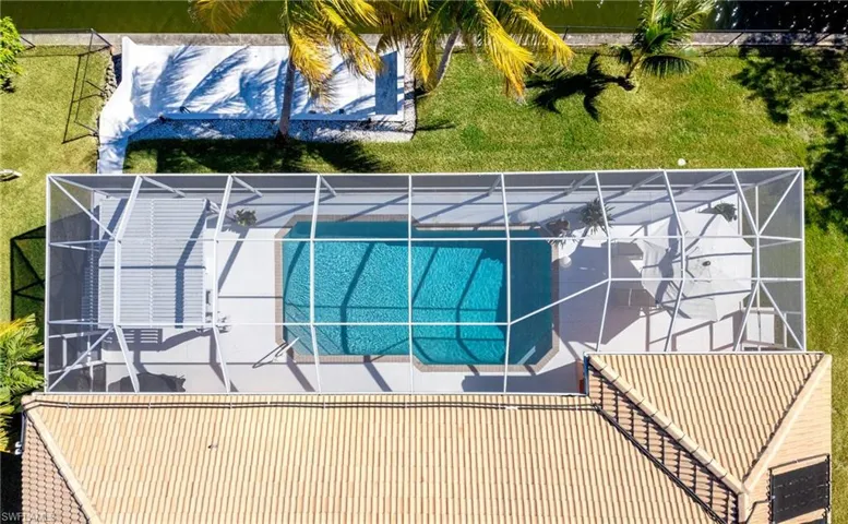View of subject property featuring a pool area