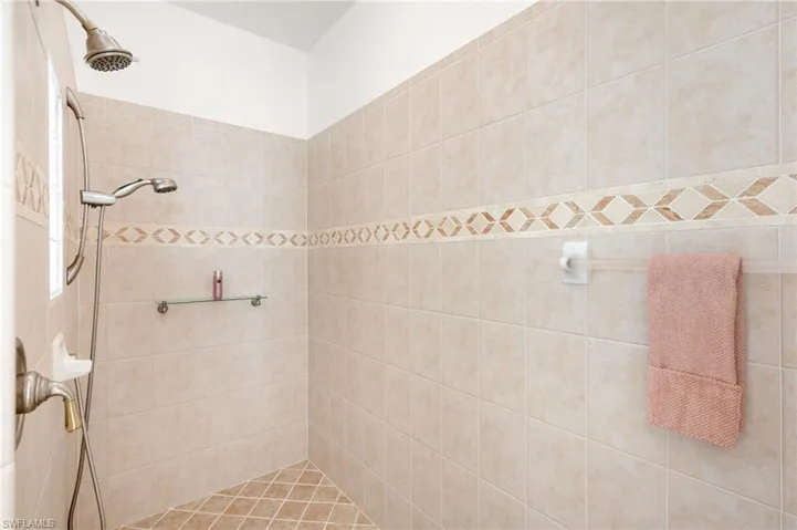 Bathroom featuring a tile shower
