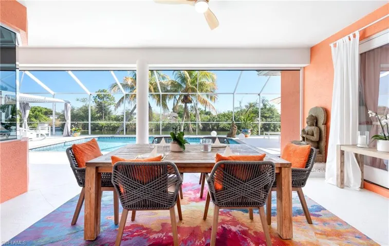 Sunroom / solarium featuring a patio, ceiling fan, and healthy amount of natural light