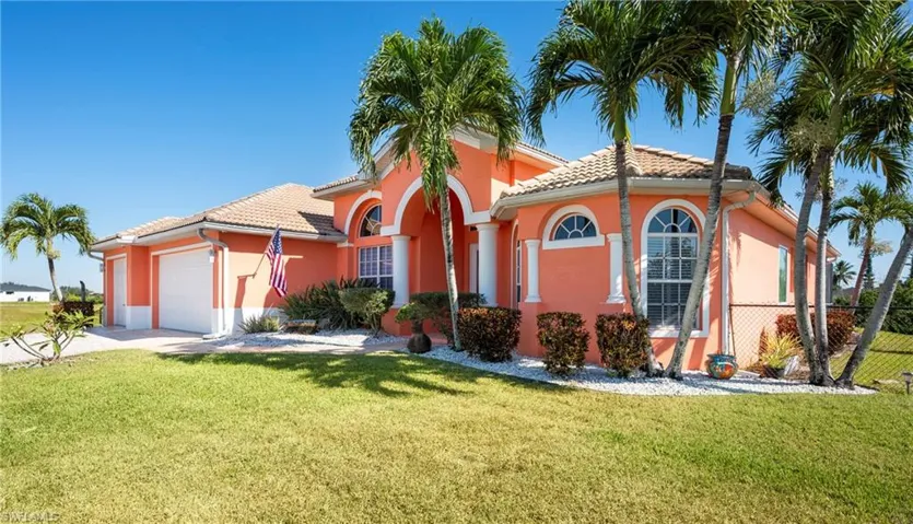 Mediterranean / spanish-style home featuring stucco siding, an attached garage, driveway, and a tile roof
