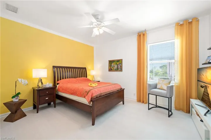 Bedroom with baseboards and a ceiling fan