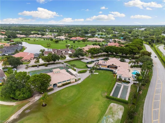 Drone / aerial view featuring a residential view, golf course view, and a water view