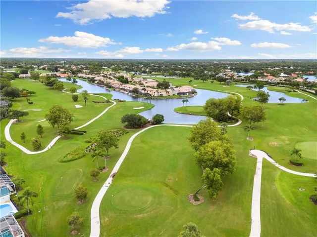Aerial view with a residential view, golf course view, and a water view