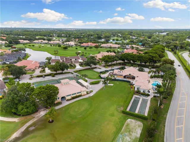 Birds eye view of property featuring view of golf course and a water view