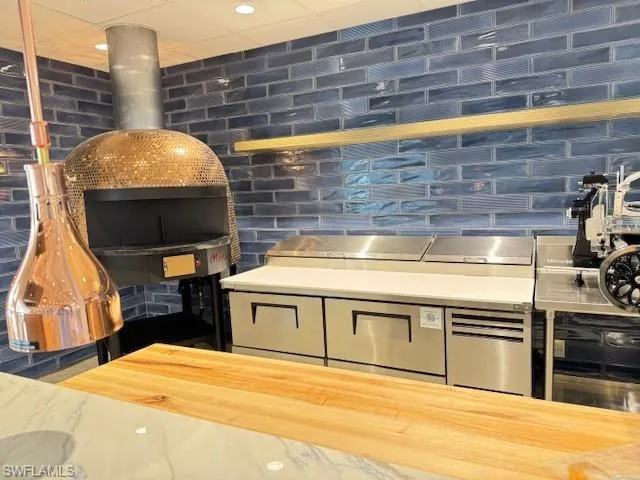 Kitchen with brick wall