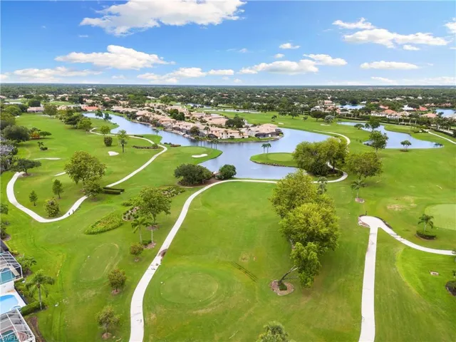 Aerial view featuring view of golf course and a water view