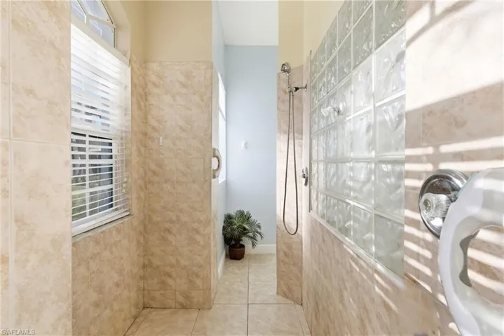 Open and airy walk-in shower that combines style, function, and indulgence.