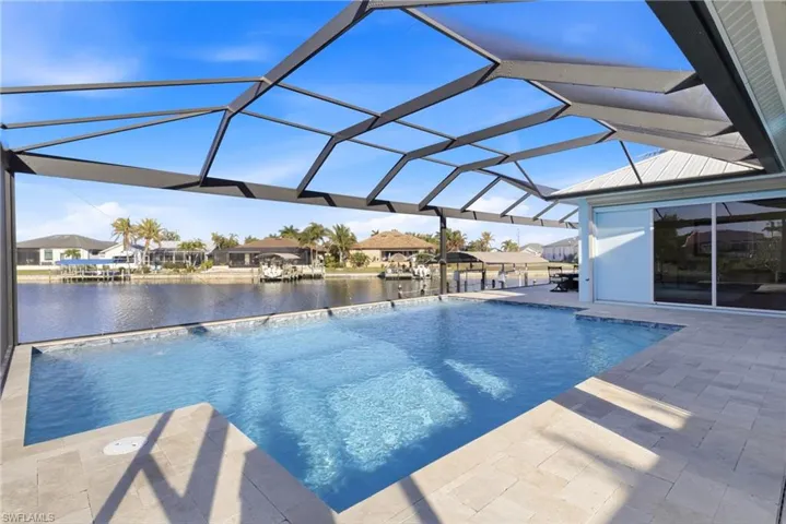 The ultimate outdoor retreat where poolside relaxation meets spectacular waterfront views.