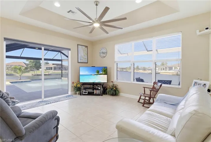 Enjoy unobstructed views as the living room flows effortlessly onto the waterfront lanai.
