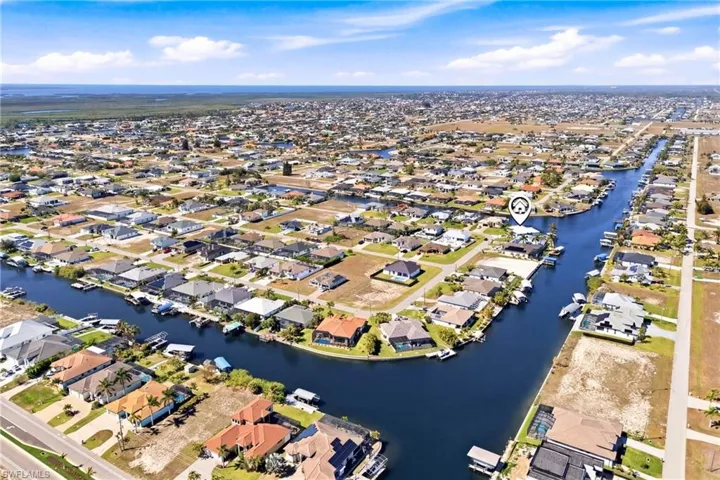 Endless water views surround this beautifully positioned Gulf-access home.